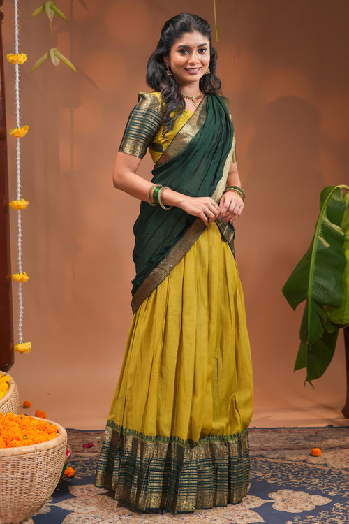 Lime yellow plain half saree with matching blouse and contrast zari border and dhavani