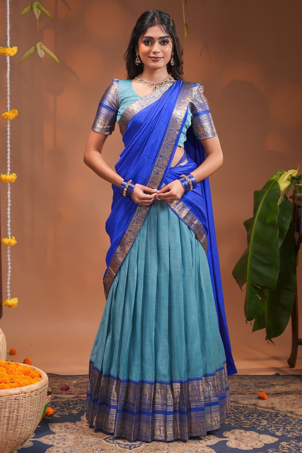Blue plain half saree with matching blouse and contrast zari border and dhavani