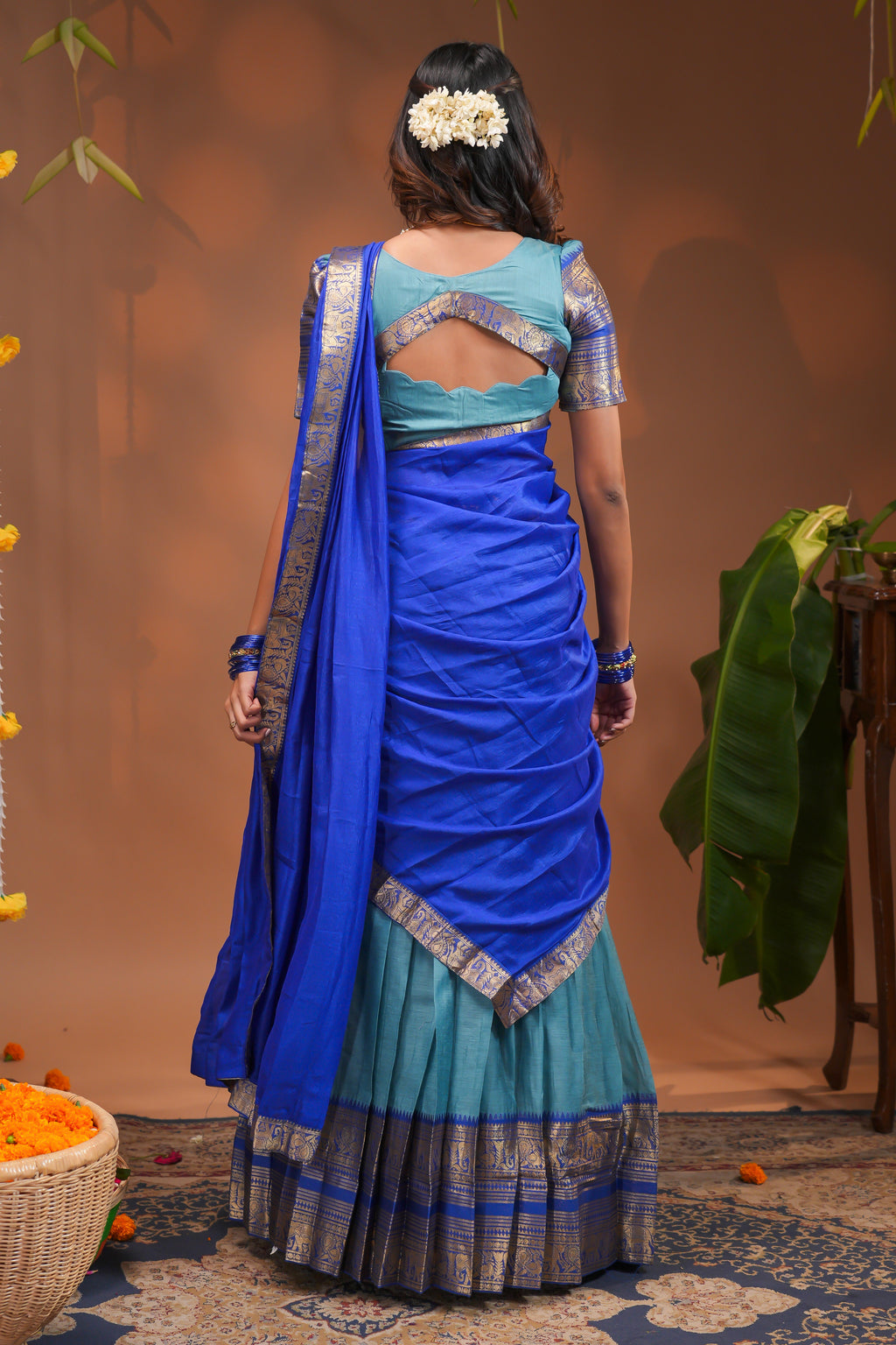 Blue plain half saree with matching blouse and contrast zari border and dhavani