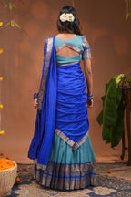 Blue plain half saree with matching blouse and contrast zari border and dhavani