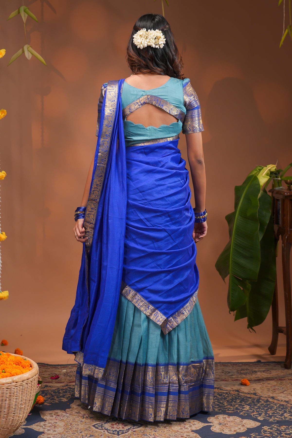 Blue plain half saree with matching blouse and contrast zari border and dhavani