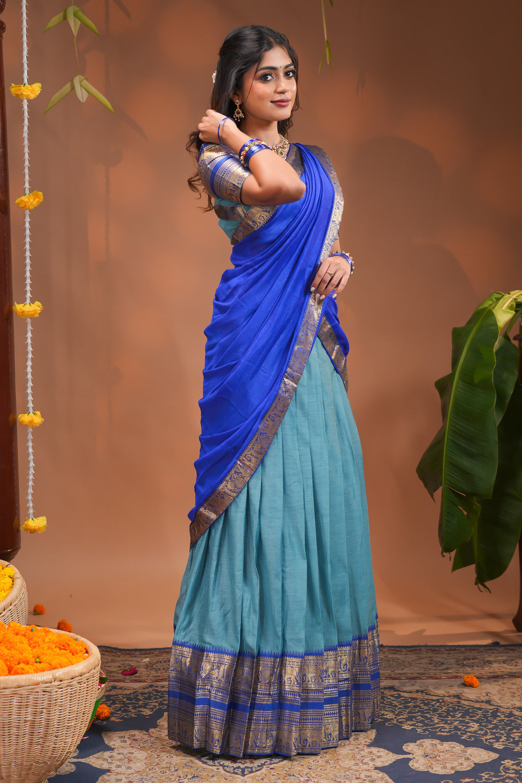 Blue plain half saree with matching blouse and contrast zari border and dhavani