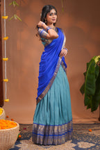 Blue plain half saree with matching blouse and contrast zari border and dhavani