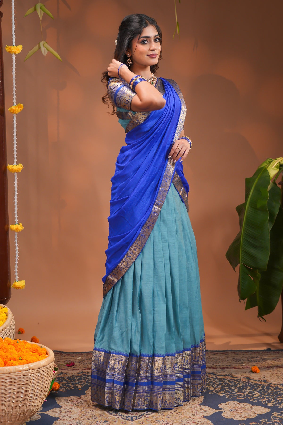 Blue plain half saree with matching blouse and contrast zari border and dhavani