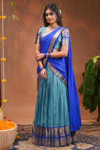 Blue plain half saree with matching blouse and contrast zari border and dhavani