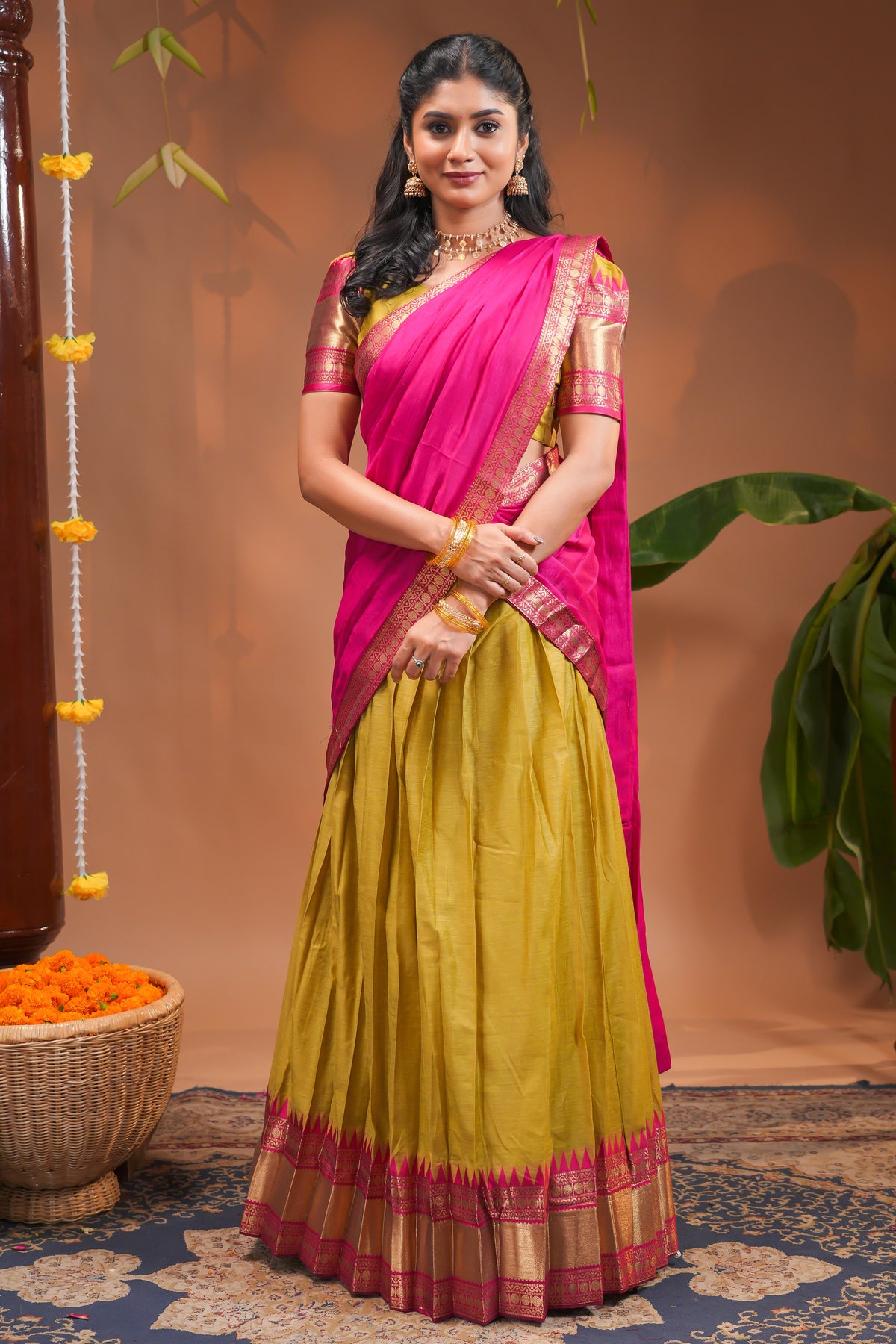 Mustard plain half saree with matching blouse and contrast zari border and dhavani