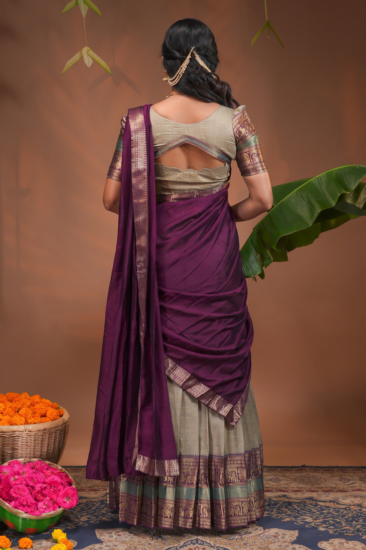 Beige plain half saree with matching blouse and contrast zari border and dhavani