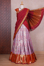 Pastel lavender jacquard floral zari design half saree with contrast zari border and dhavani