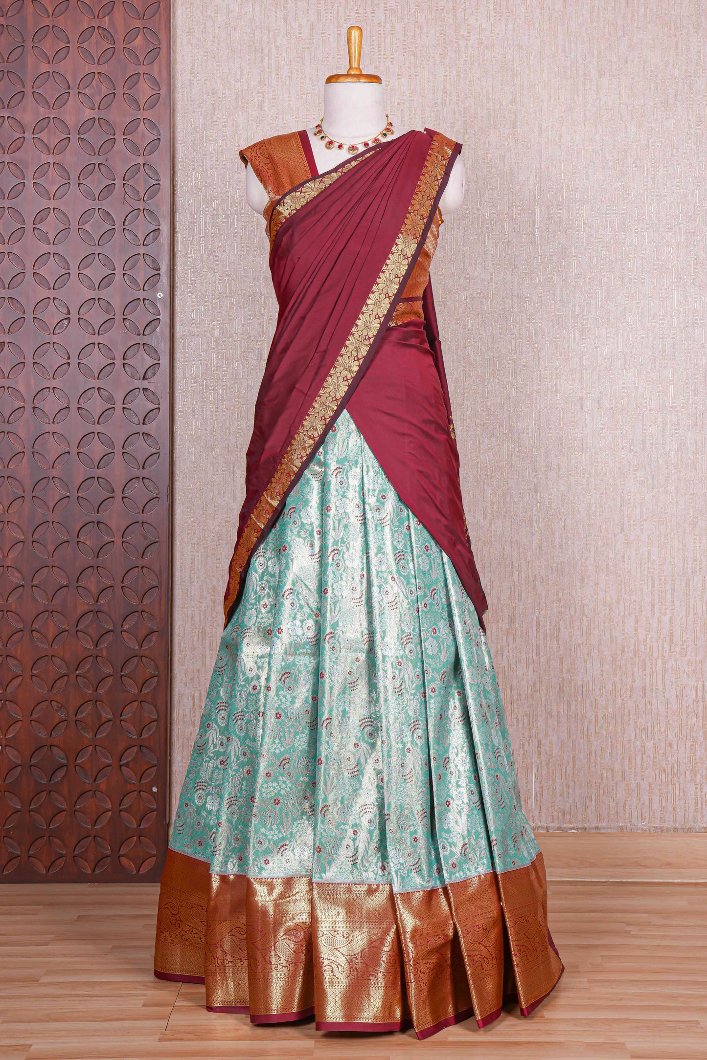 Turquoise green jacquard floral zari design half saree with contrast zari border and dhavani