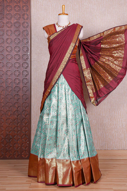 Turquoise green jacquard floral zari design half saree with contrast zari border and dhavani