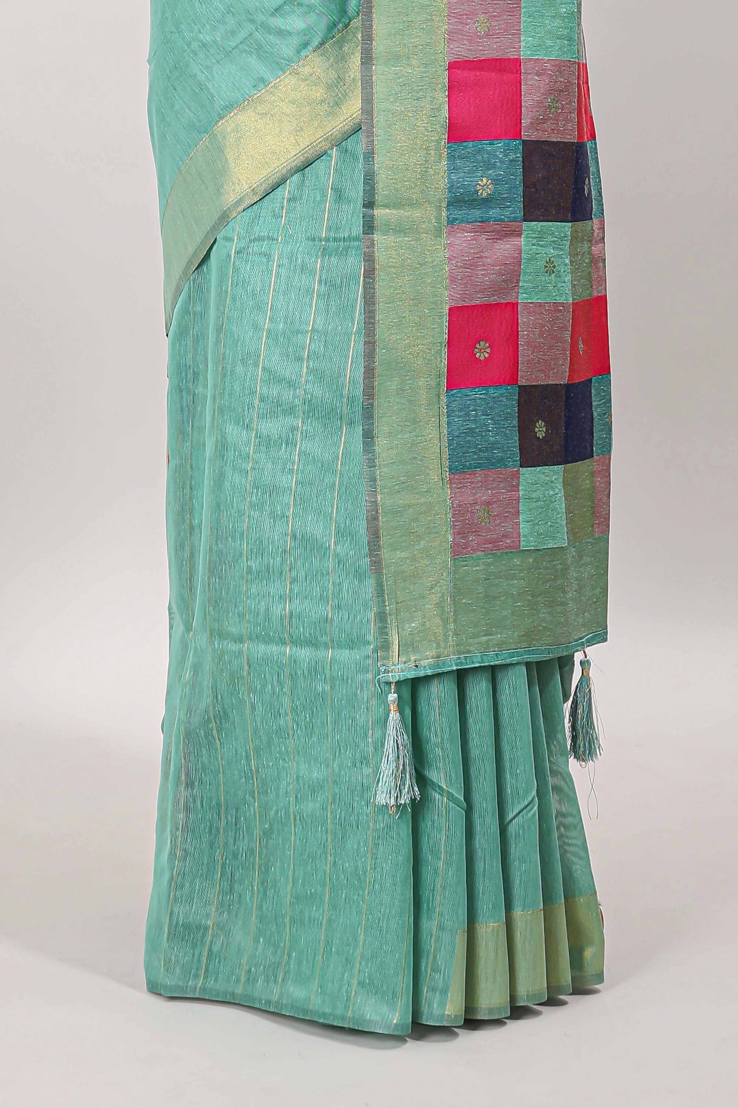 Turquoise green striped linen cotton saree with self zari border contrast checked pallu