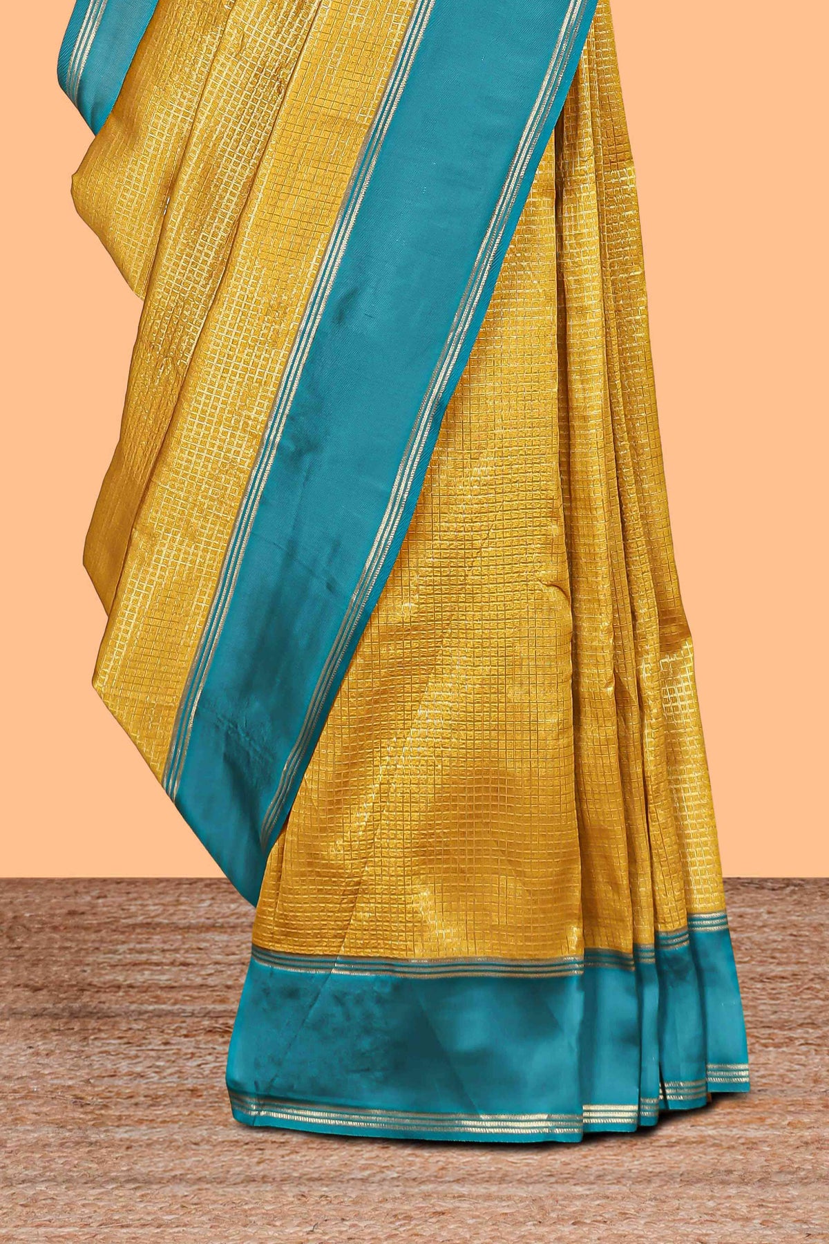 Golden yellow zari checked art litchi silk saree with contrast border and zari butta blouse