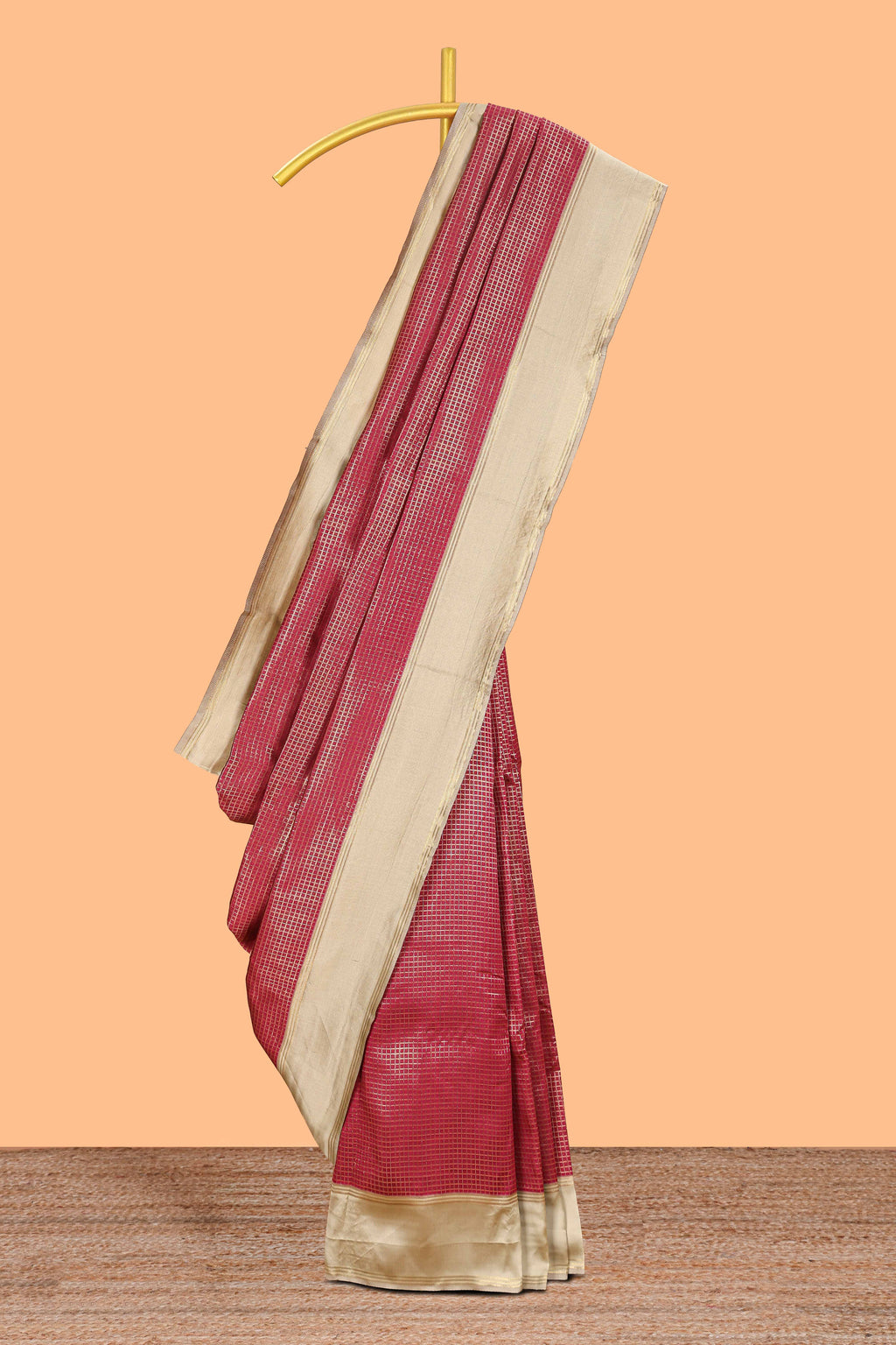 Maroon zari checked art litchi silk saree with contrast border and zari butta blouse