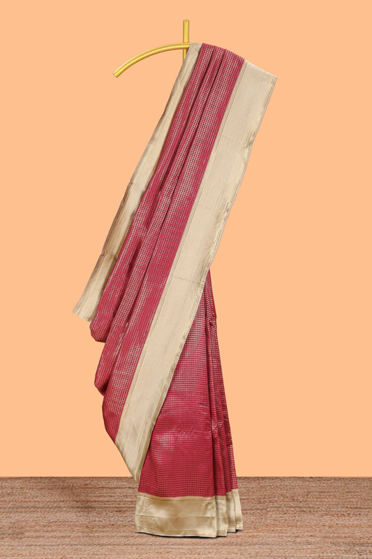 Maroon zari checked art litchi silk saree with contrast border and zari butta blouse