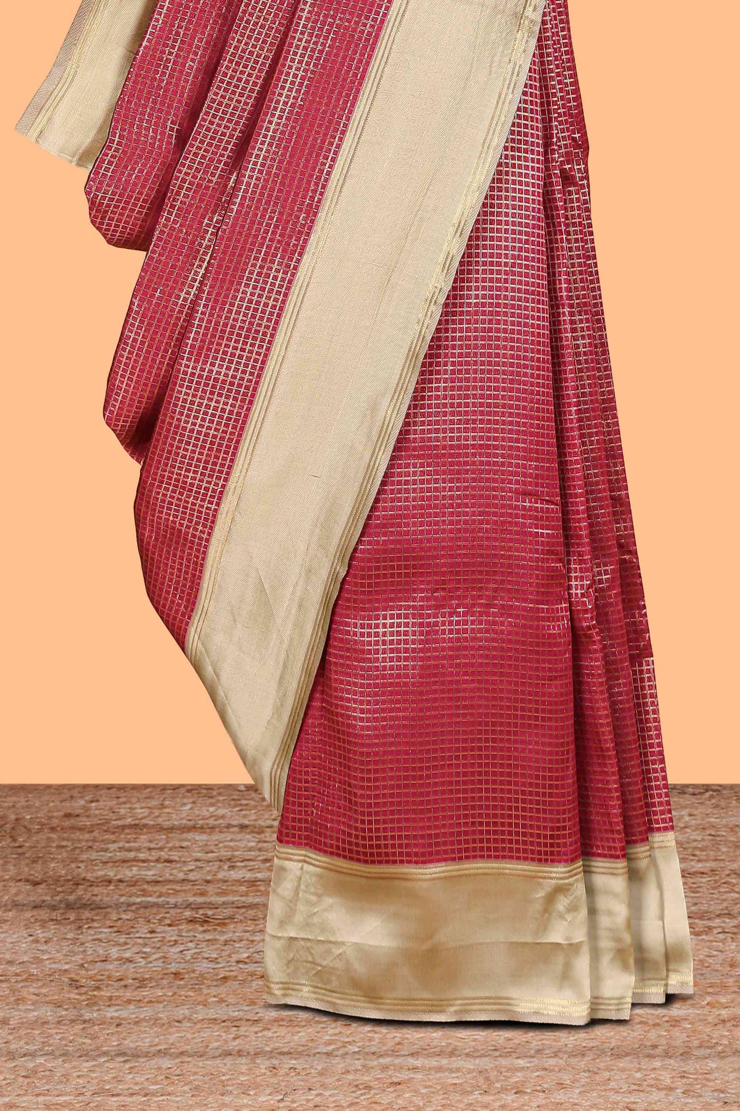 Maroon zari checked art litchi silk saree with contrast border and zari butta blouse