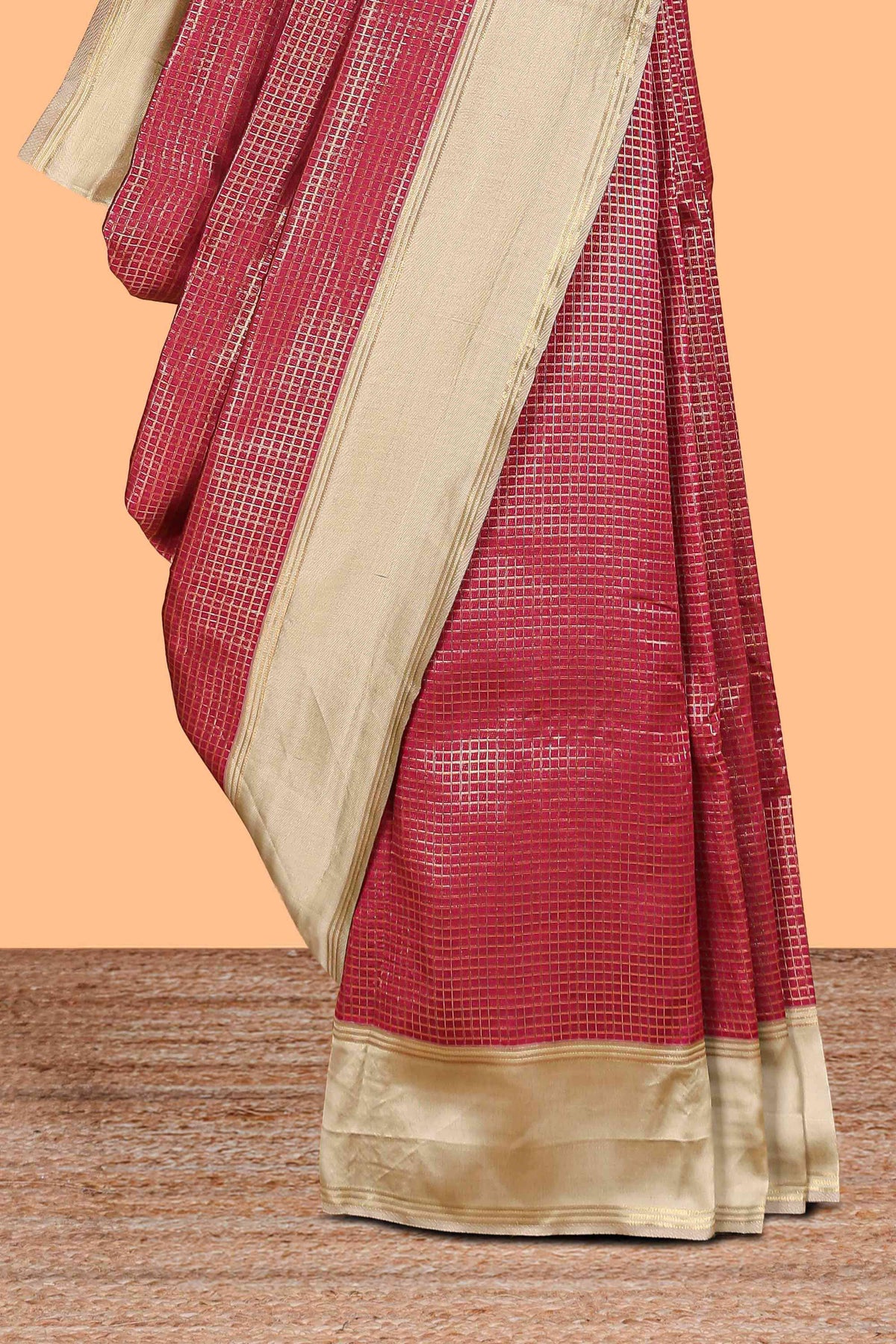 Maroon zari checked art litchi silk saree with contrast border and zari butta blouse