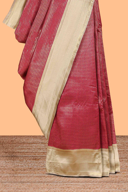 Maroon zari checked art litchi silk saree with contrast border and zari butta blouse