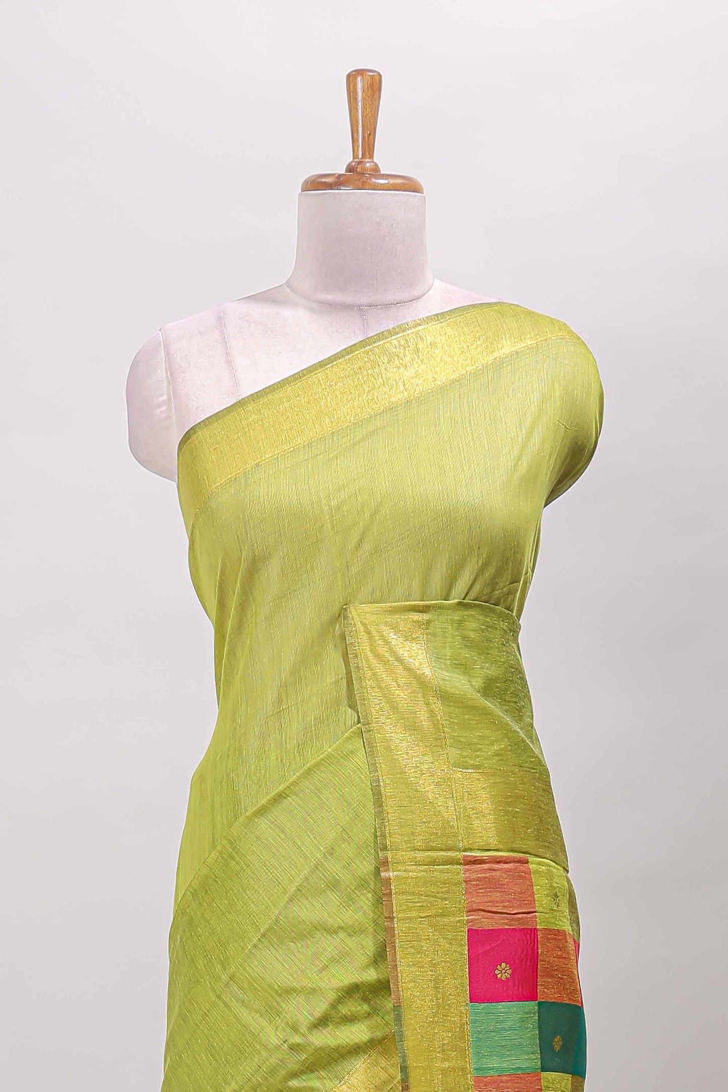 Green striped linen cotton saree with self zari border contrast checked pallu