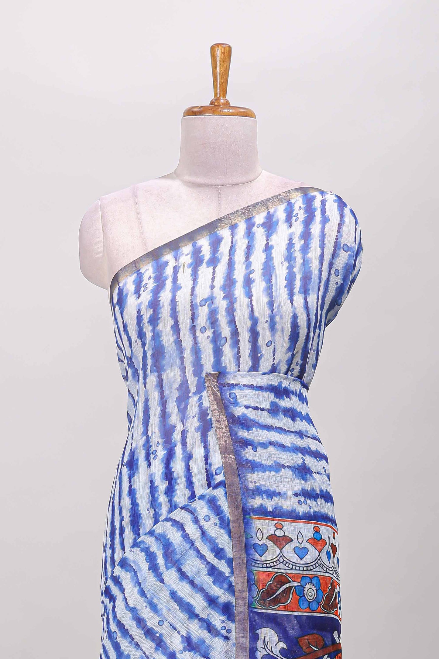 Blue striped shibori print linen cotton saree with self zari border and printed pallu