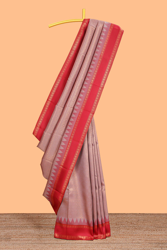 Peach checked geometric design litchi silk saree with contrast ikkat style bentex zari border and blouse