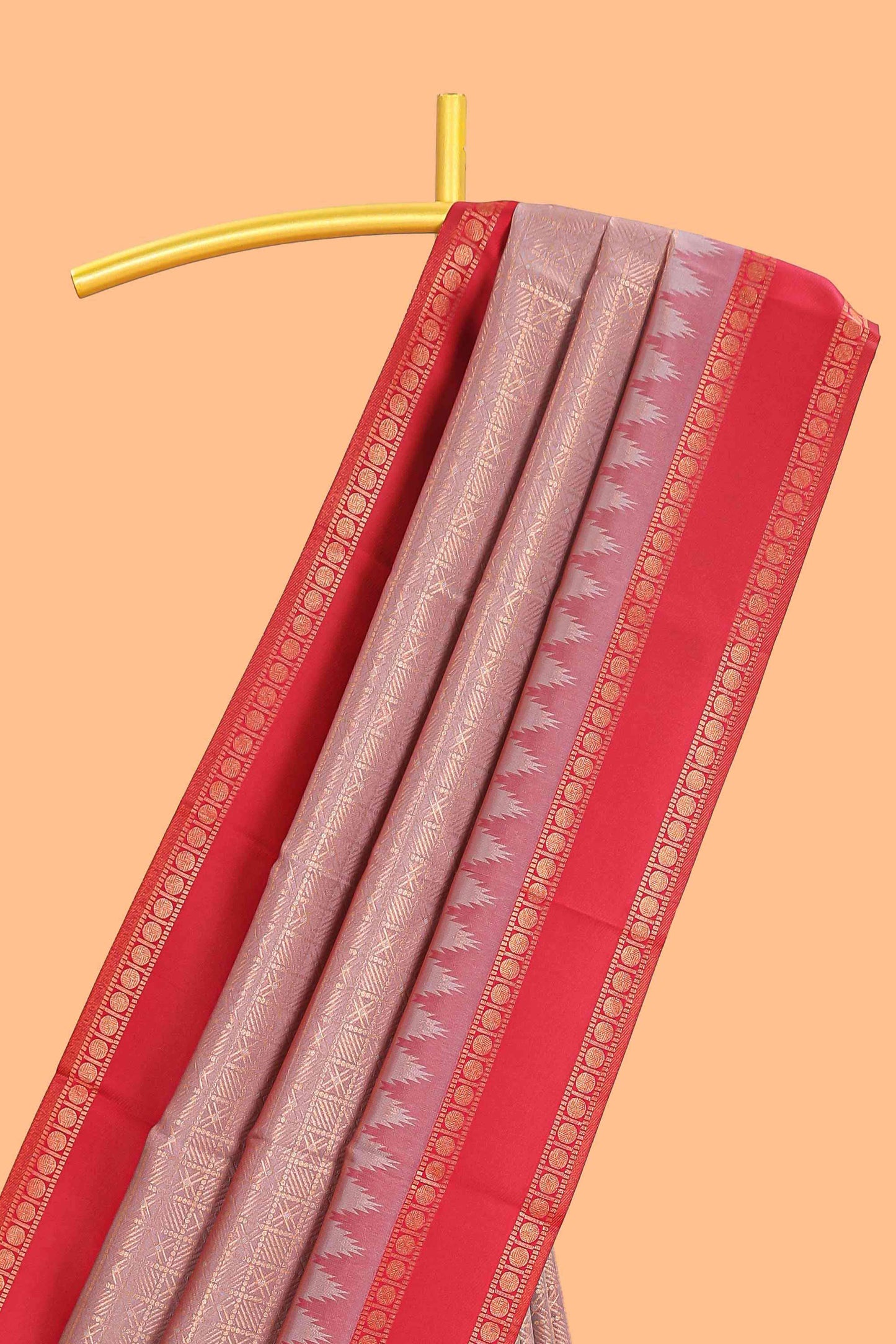 Peach checked geometric design litchi silk saree with contrast ikkat style bentex zari border and blouse