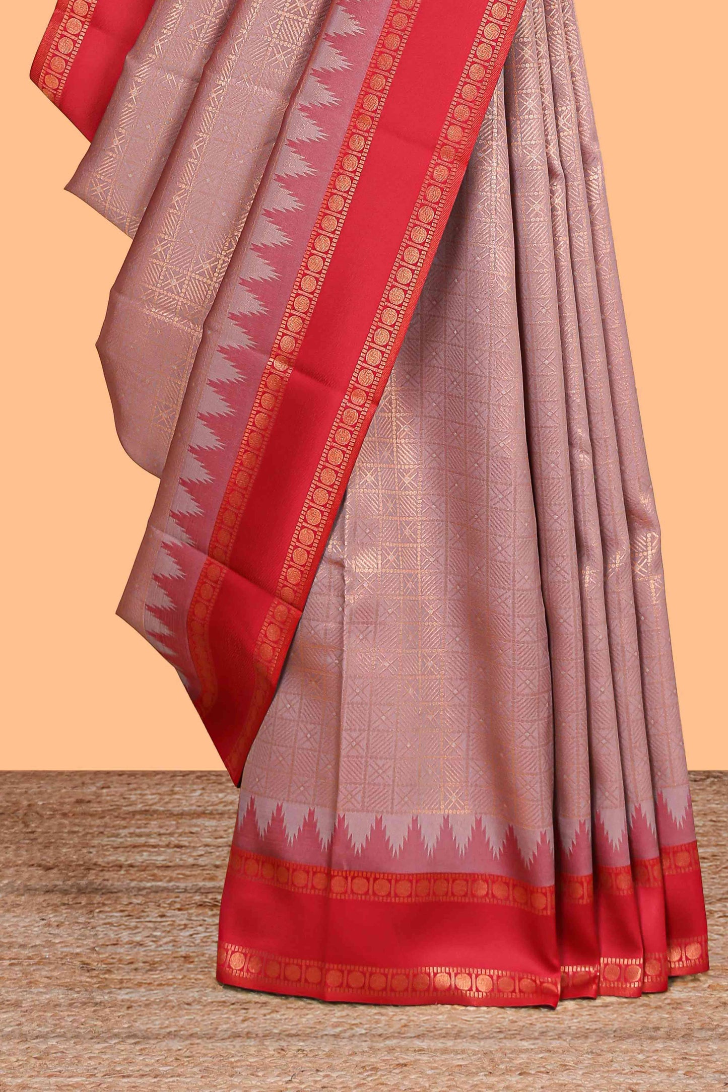 Peach checked geometric design litchi silk saree with contrast ikkat style bentex zari border and blouse