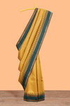 Mustard checked geometric design litchi silk saree with contrast ikkat style bentex zari border and blouse