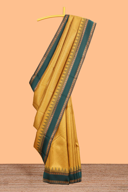 Mustard checked geometric design litchi silk saree with contrast ikkat style bentex zari border and blouse