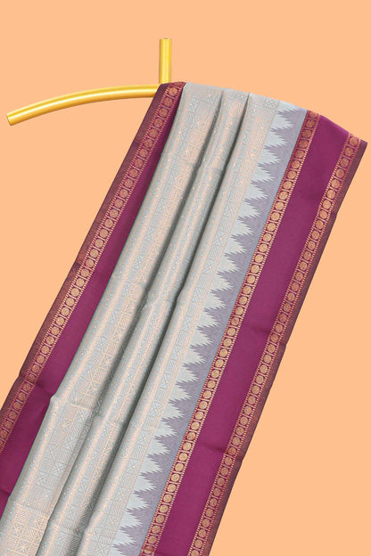 Turquoise green checked geometric design litchi silk saree with contrast ikkat style bentex zari border and blouse