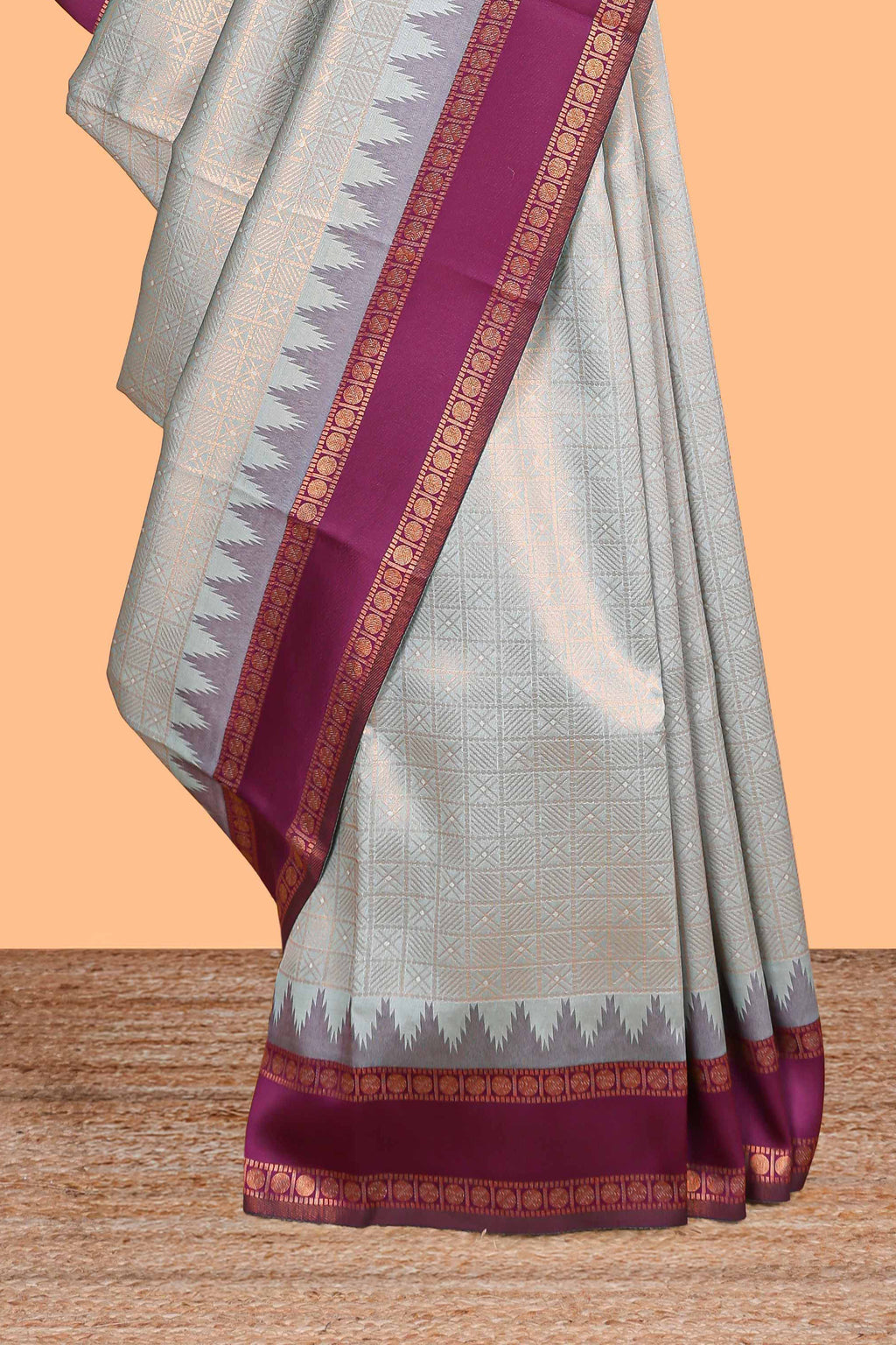 Turquoise green checked geometric design litchi silk saree with contrast ikkat style bentex zari border and blouse