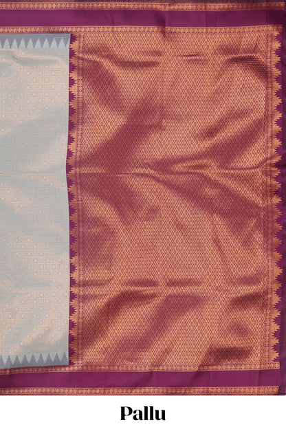 Turquoise green checked geometric design litchi silk saree with contrast ikkat style bentex zari border and blouse