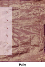 Pale pink checked geometric design litchi silk saree with contrast zari border and blouse