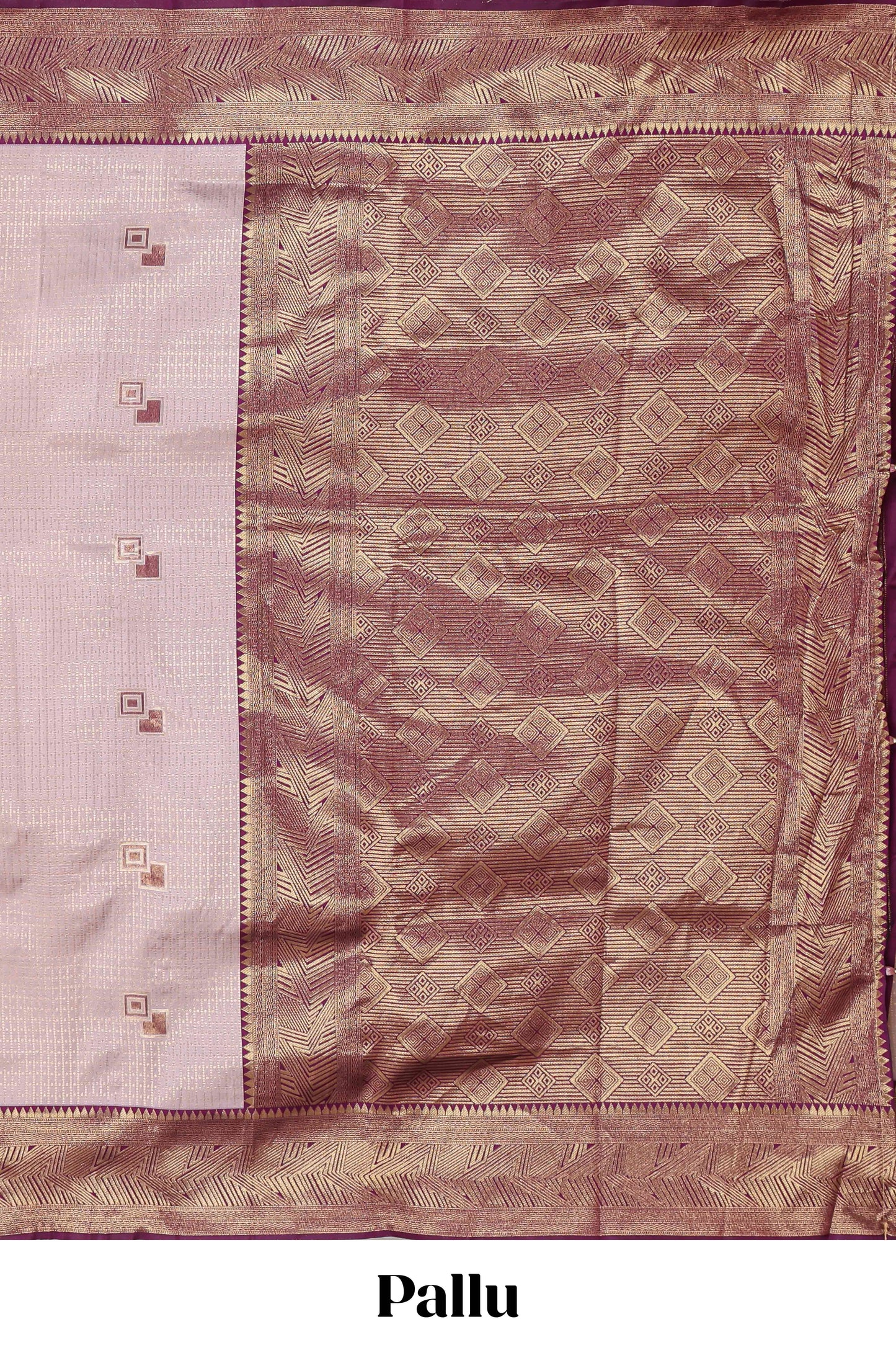 Pale pink checked geometric design litchi silk saree with contrast zari border and blouse