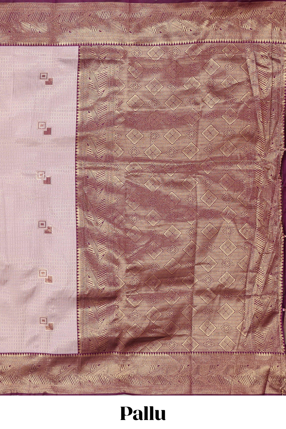 Pale pink checked geometric design litchi silk saree with contrast zari border and blouse