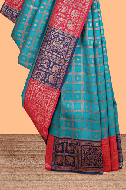 Turquiose green checked floral motifs litchi silk saree with contrast zari border and zari butta blouse