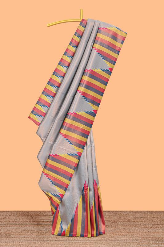 Grey plain litchi silk saree with contrast multi color ikkat style border and blouse