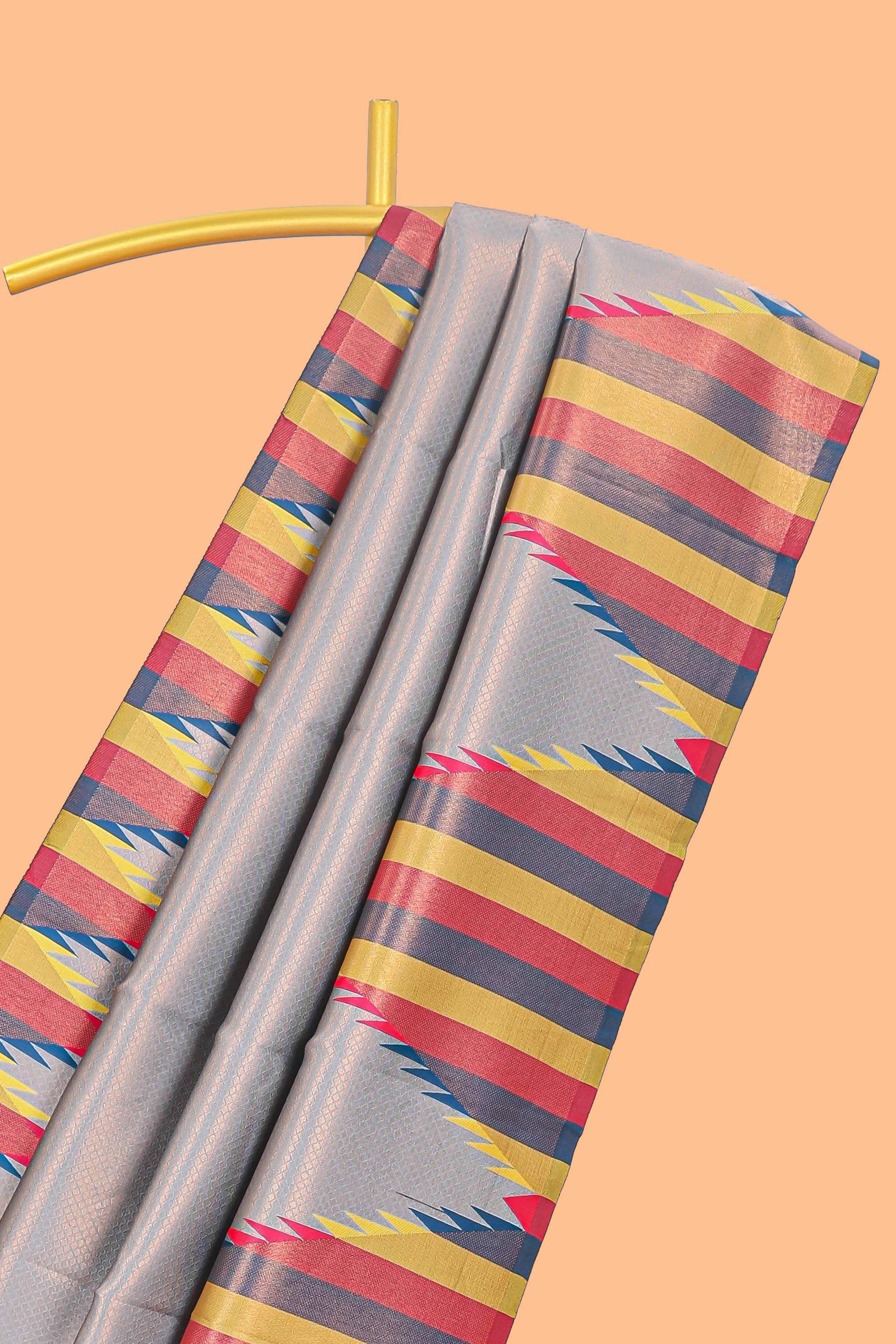 Grey plain litchi silk saree with contrast multi color ikkat style border and blouse