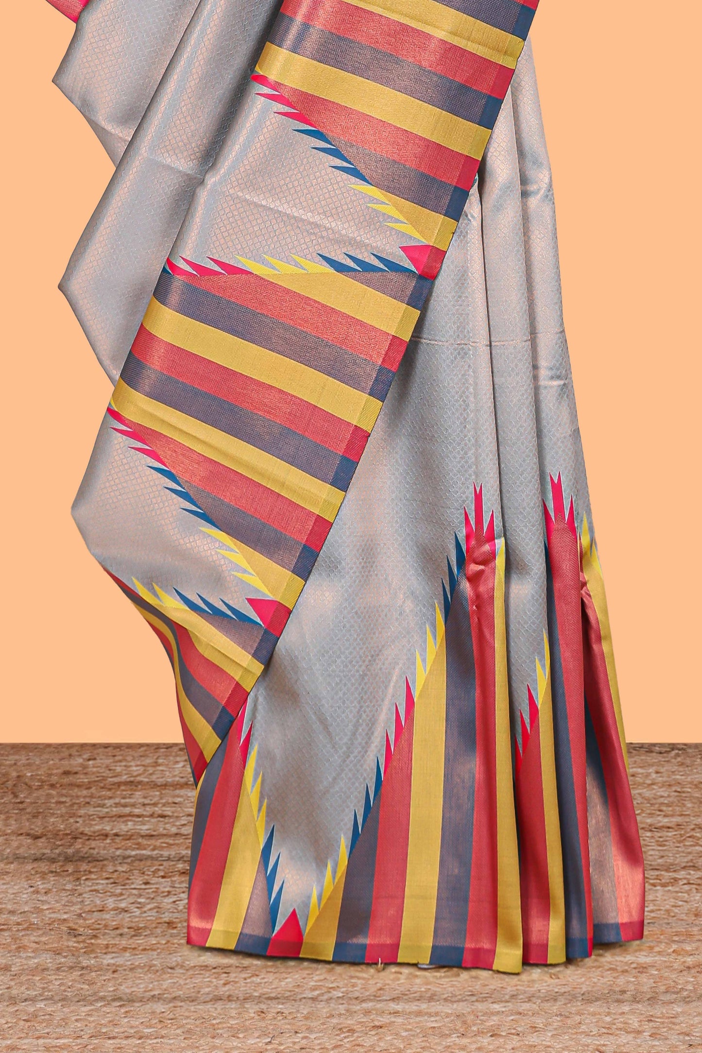 Grey plain litchi silk saree with contrast multi color ikkat style border and blouse