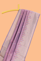 Sunset purple geometric style motifs litchi silk saree with contrast striped border and blouse