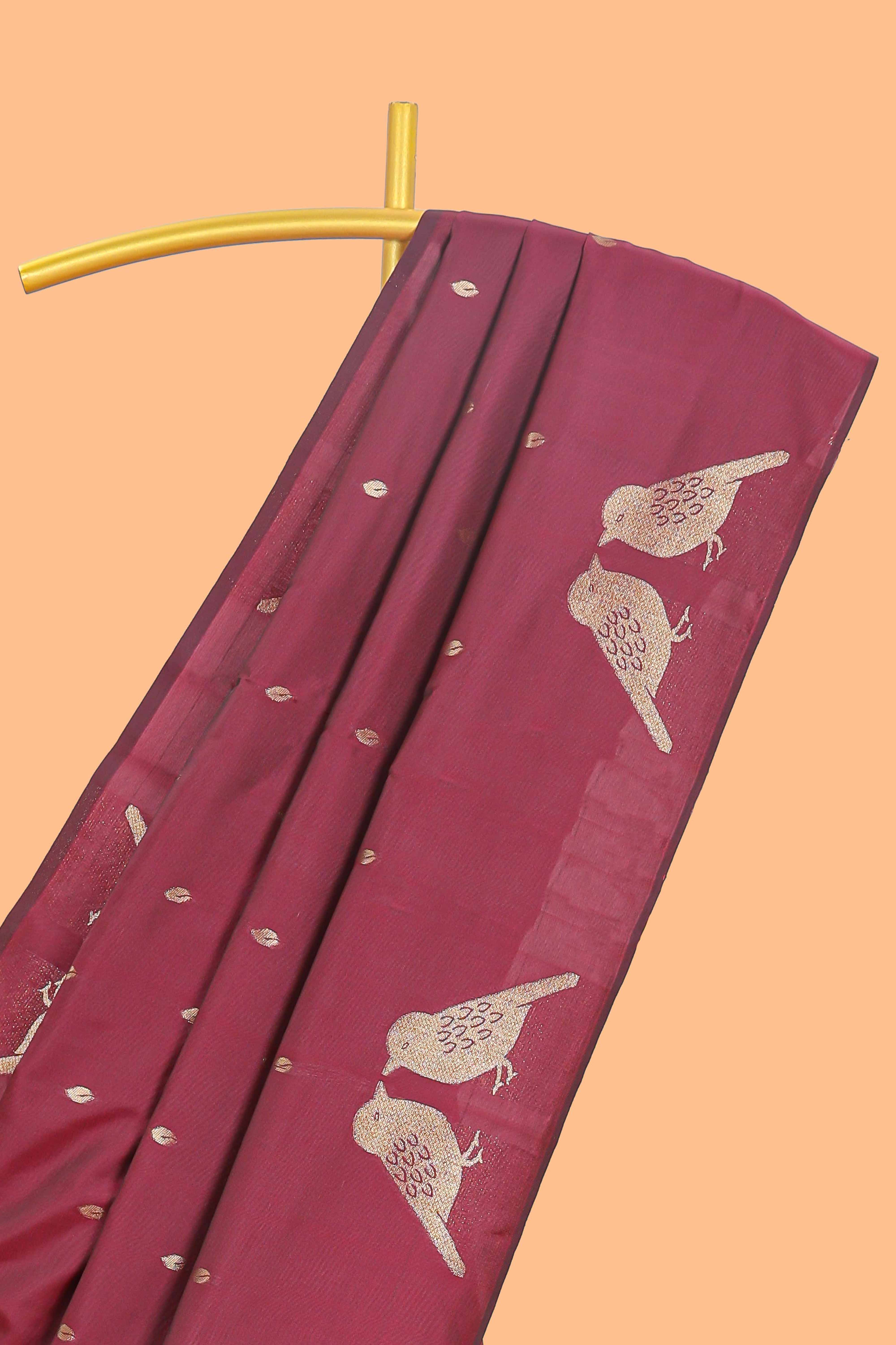 Borderless maroon leaf zari butta and birds design semi soft silk saree with self pallu and matching blouse