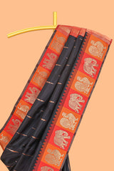 Black litchi silk saree with contrast elephant & peacock zari border and blouse