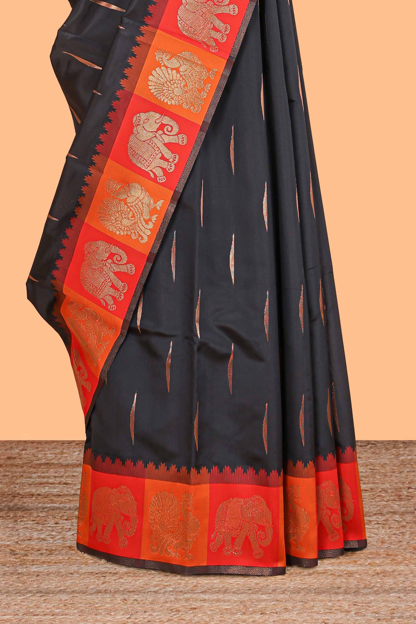 Black litchi silk saree with contrast elephant & peacock zari border and blouse