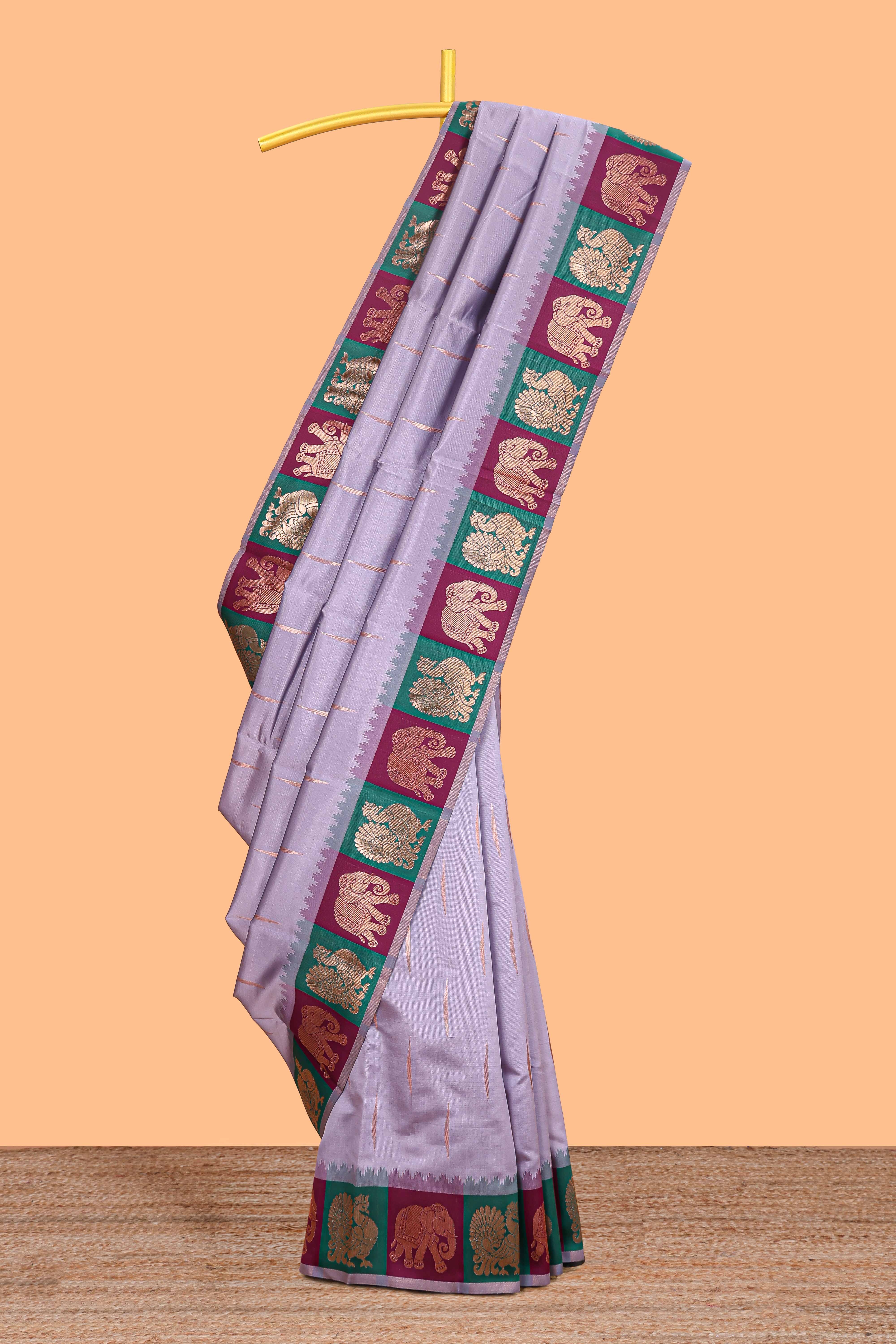 Lavender litchi silk saree with contrast elephant & peacock zari border and blouse
