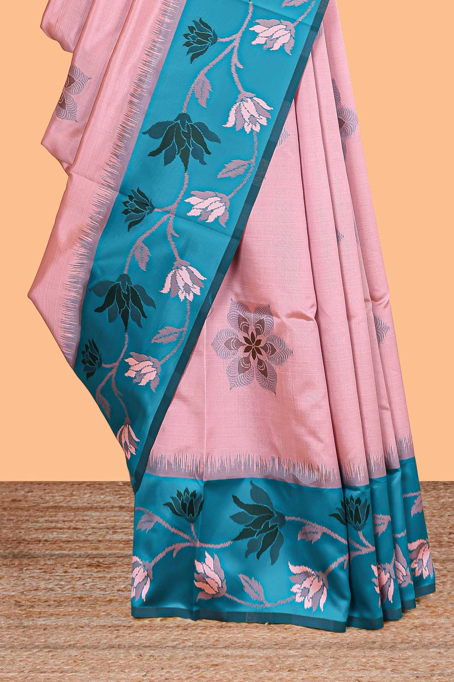 Baby pink floral motifs litchi silk saree with contrast floral vine border and blouse