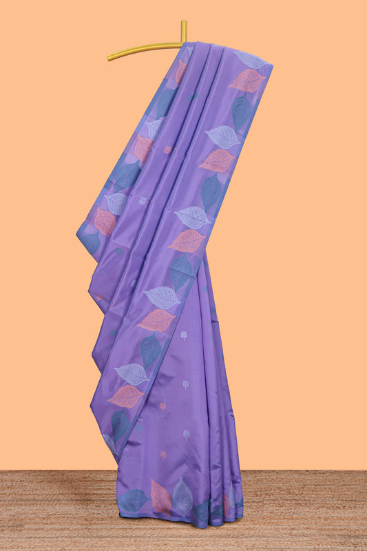 Borderless lavender floral motifs litchi silk saree with multi color bottom leaf designs and contrast blouse