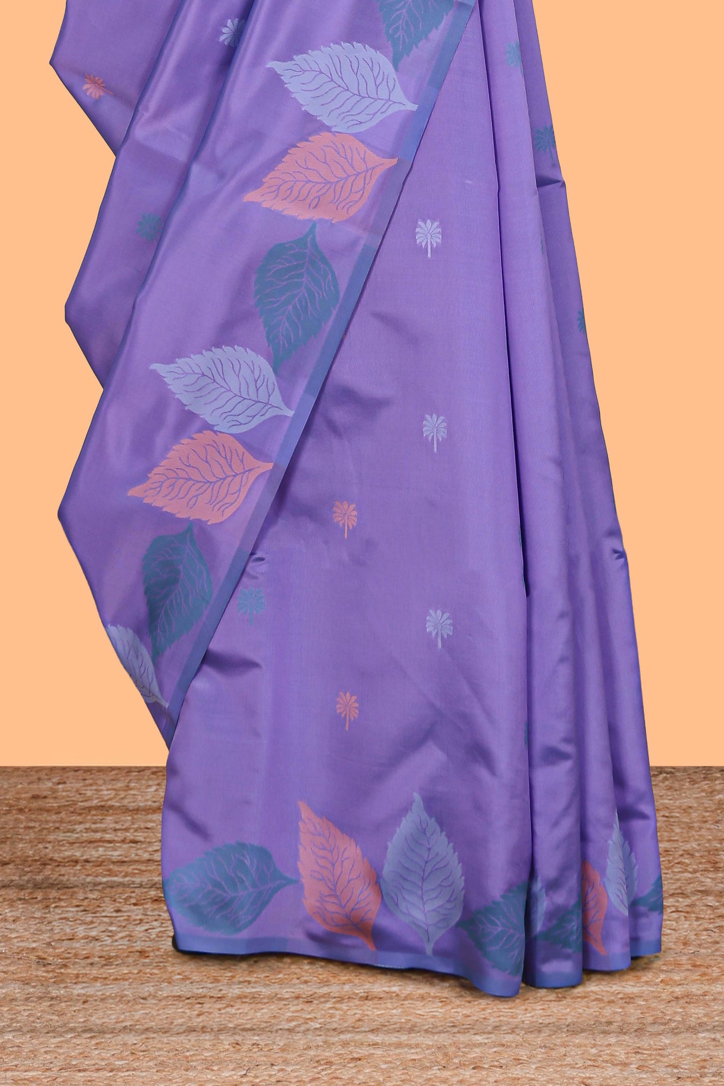 Borderless lavender floral motifs litchi silk saree with multi color bottom leaf designs and contrast blouse