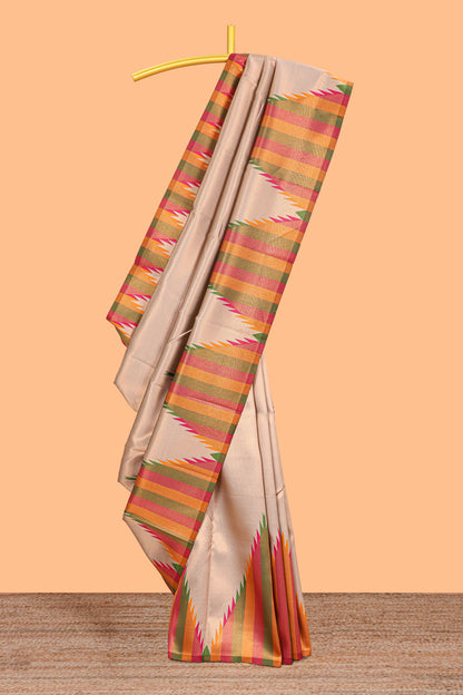 Beige plain litchi silk saree with contrast multi color ikkat style border and blouse