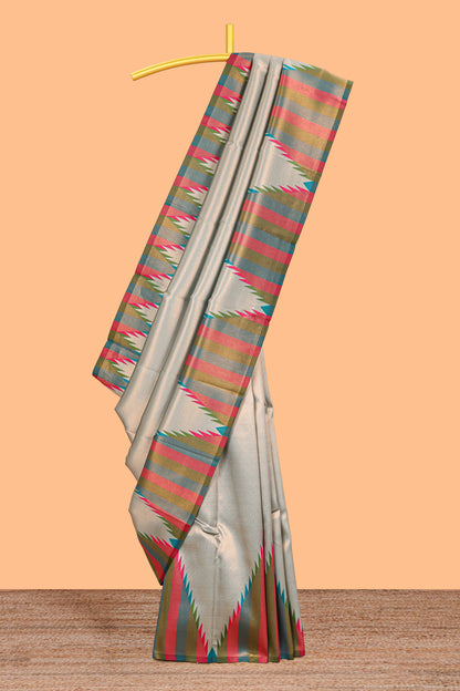 Green plain litchi silk saree with contrast multi color ikkat style border and blouse