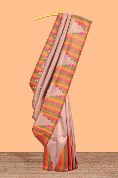 Pale pink plain litchi silk saree with contrast multi color ikkat style border and blouse