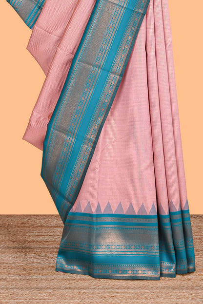 Pink zari textured litchi silk saree with contrast zari border and floral motifs blouse